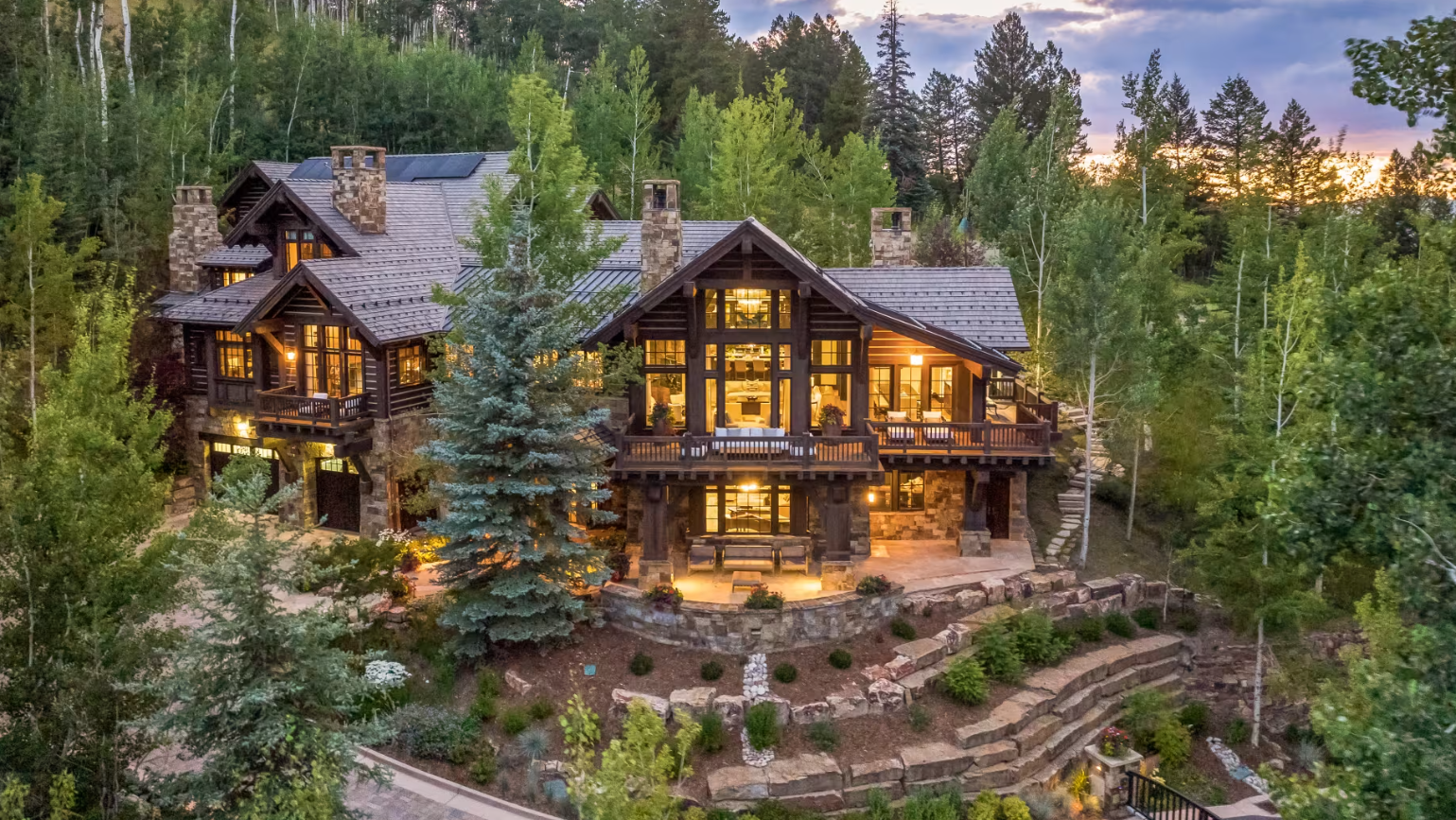 Luxury log cabin with professional stucco and painting work by Genesis Painting